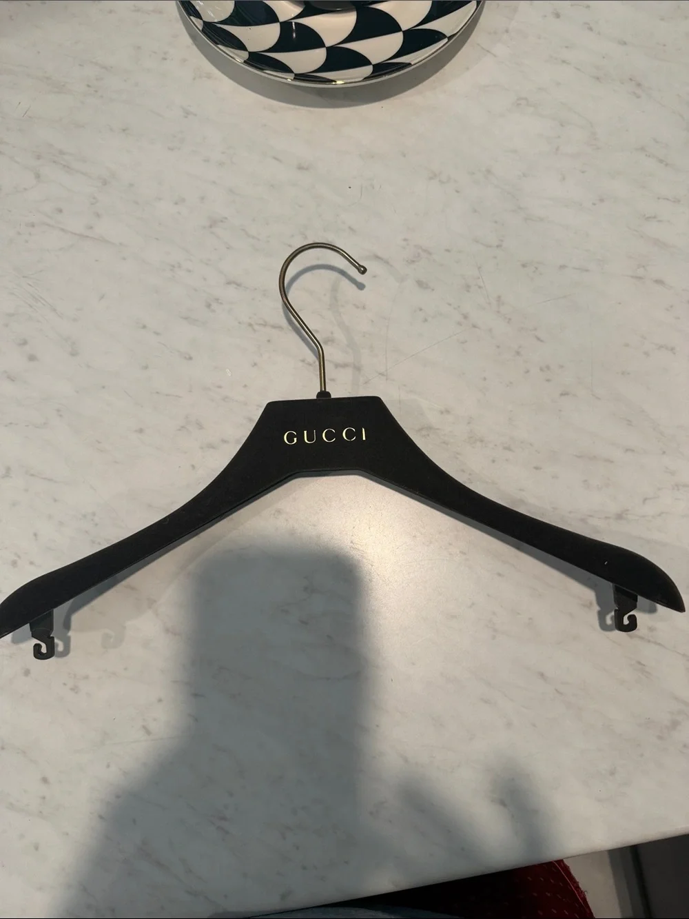 Gucci Black Hanger with Gold Logo Accent
